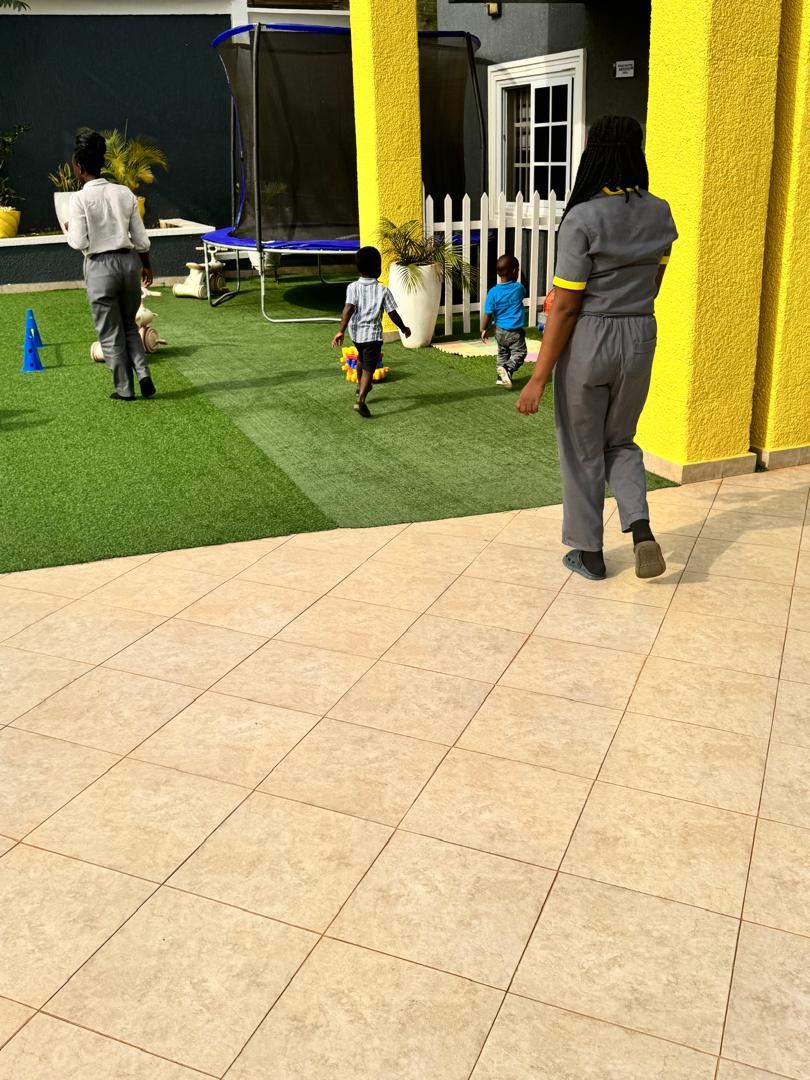 Young children playing outdoors at HoneyBerry